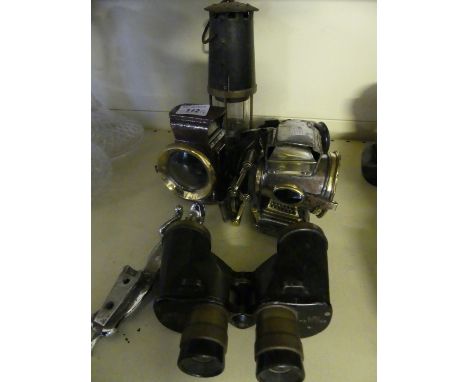 A mixed lot comprising Jaguar car mascot, Canadian war issue binoculars, miners lamp, Lucas lantern, two other similar (6)
