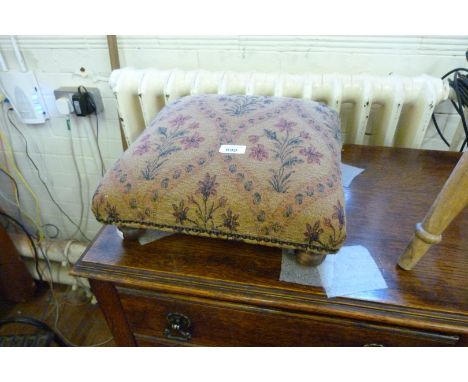 Two Vintage footstools, each upholstered with tapestry covers.