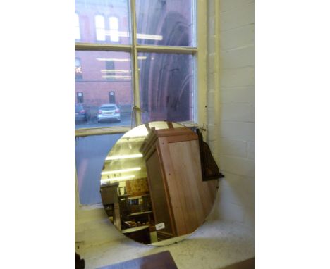 An Art Deco circular wall mirror The top section having applied medium oak geometric motifs, diameter 56cm. 