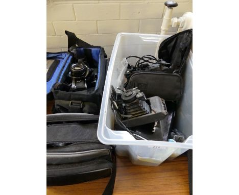 A collection of various cameras and related equipment, to include Samsung digital cam, Panasonic video camera, Pentax camera 