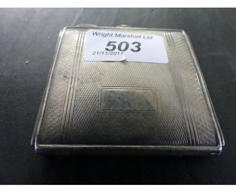 A Birmingham hallmarked silver powder compact with engine turned decoration.