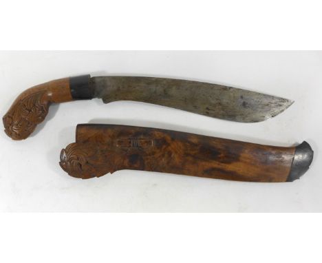 An Indian knife, late 19th/early 20th Century26cm single edged blade, with carved hardwood grip complete with matching scabba