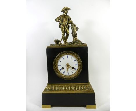 A late 19th Century French figural mantel clockThe circular white enamel dial with Roman numerals and floral mounted bezel, t