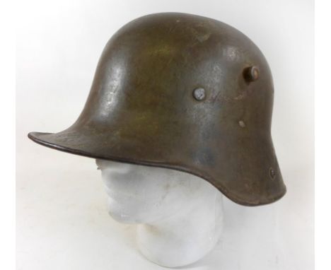 An Imperial German WWI M17 steel helmetSteel helmet with parts of the original liner, helmet stamped ET66CONDITION REPORT/ADD