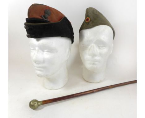 A Royal Artillery side cap, early 20th CenturyComplete with cap badge and buttons, a West German army side cap and a Cheshire