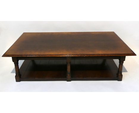 A good quality reproduction Titchmarsh & Goodwin oak coffee tableThe rectangular top raised on six turned legs with shelf to 