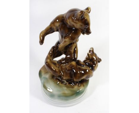 A Zsolnay Pecs model of two fighting bearsRaised on a plinth base, marked to reverse 'Markap Bela', height 30cm 