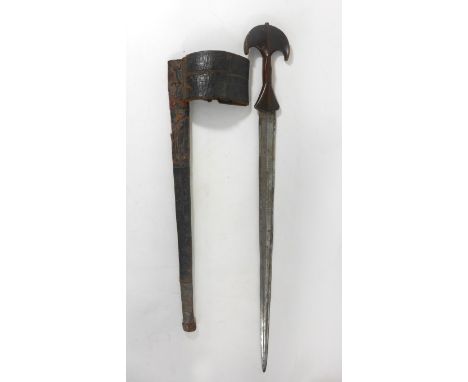 An African short sword, late 19th/early 20th Century48cm tapering double edged blade with incised decoration, elaborate woode