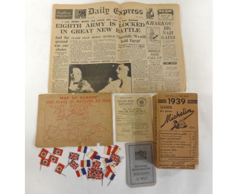 A collection of WWII memorabiliaTo include a copy of Daily Express dated February 26th 1942, Michelin Guide dated 1939, subje