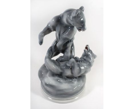 A Zsolnay Pecs model of two fighting bearsFinished in grey glaze, marked with designers name Markap Bela dated 1911 to revers
