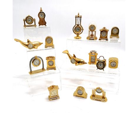 Qty of novelty miniature brass quartz clocks inc 2 x dolphins, lyre shaped, anniversary clock under dome (6.5cm high), dice e
