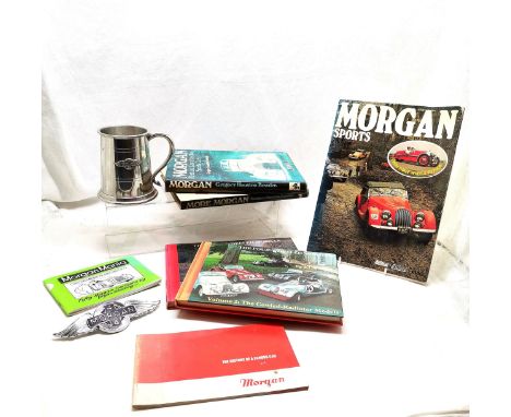 Morgan winged 4/4 car badge (15cm) t/w Morgan tankard (some dents), Morgan related books / magazines inc 1 book signed by Ken