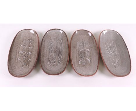 David Leach (1911 - 2005), Lowerdown Pottery, a set of four oval shaped pottery dishes each incised with a different plant, b