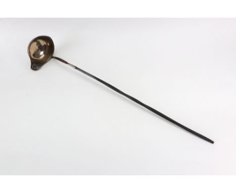 A George III silver punch ladle, makers mark unclear, circa 1790, the oval single lipped bowl with punched gadroon edge, twis