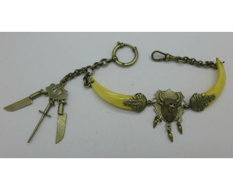 A nickel set butchers Albert chain with bull and tools