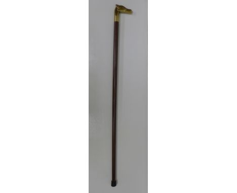 A modern walking stick with brass horse head handle and glass spirit flask