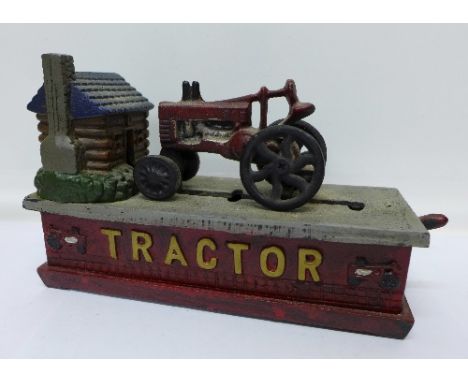 A reproduction novelty cast metal tractor money bank