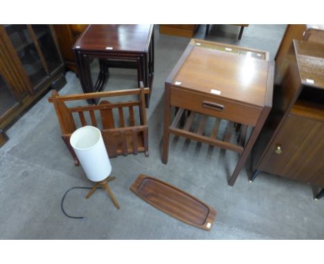 A small teak side table, a tray, table lamp and a magazine rack 