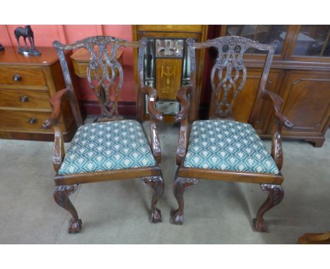 A pair of Chippendale Revival carved mahogany elbow chairs 