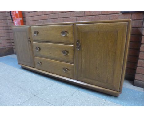 An Ercol elm Windsor sideboard 