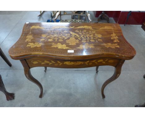 A Dutch mahogany and marquetry inlaid fold over card table 