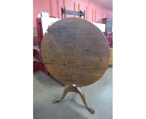 A George III mahogany circular tilt top tripod tea table 