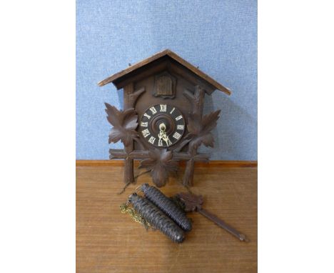 A Black Forest pine wall hanging cuckoo clock 