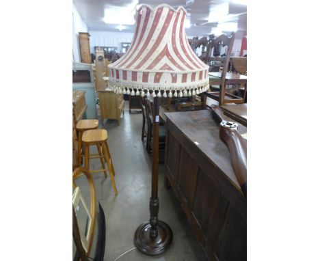A mahogany standard lamp 