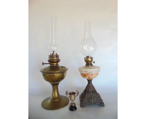 Arts & Crafts oil lamp together with a further oil lamp with mottled glass bowl and a small silver twin handled trophy (3) 