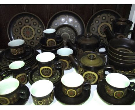 A quantity of Denby Arabesque brown ground wares including coffee pot, two graduated teapots, milk jug, sugar bowl, four dinn