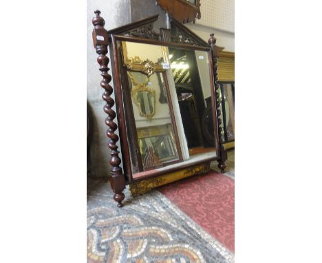 A late 19th century mahogany wall mirror with barley twist column supports and architectural pediment together with a 19th ce