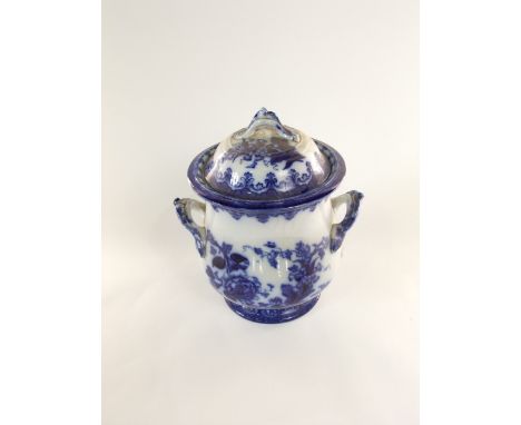 A 19th century blue and white printed flow blue type two handled crock and cover with floral and scrolling detail and impress