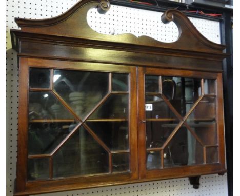 A small good quality mahogany wall cabinet in the Georgian style with swan neck pediment over a pair of astragal glazed panel