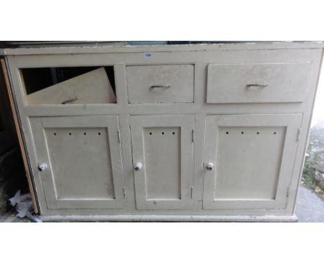 A vintage painted pine kitchen dresser base enclosed by three panelled doors beneath three frieze drawers (AF), 5ft long appr