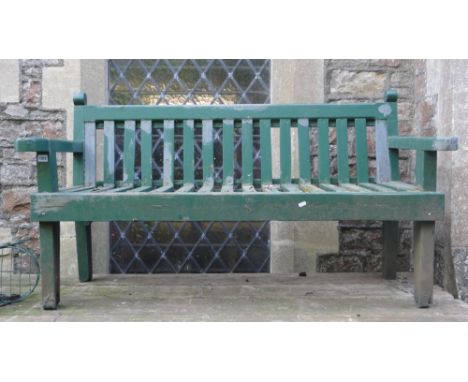 A wooden garden bench with slatted seat and back beneath a chamfered rail with all over green painted finish (AF), 5ft long a