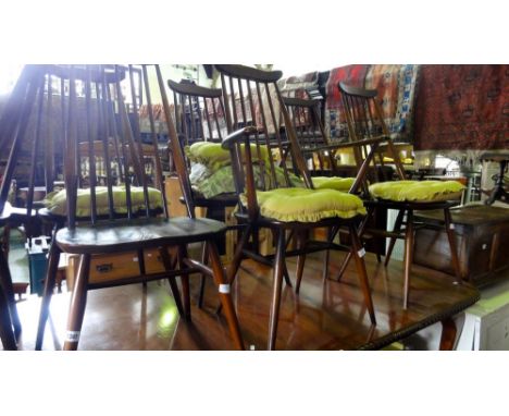 Six Ercol Goldsmith dark elm dining chairs to include two carvers