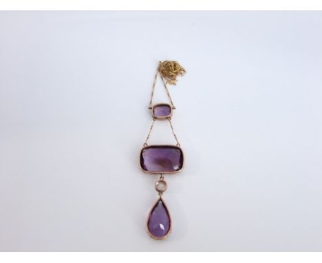 An impressive 19th century, 9ct gold and amethyst pendant necklace with collet-set paste stone; three large free cut amethyst