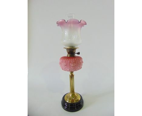 A good quality Victorian brass and opaline glass oil lamp with etched glass shade.