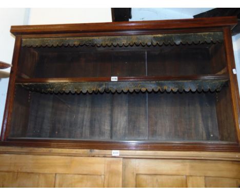 An Edwardian mahogany side cabinet enclosed by a pair of astragal glazed panelled doors with bevelled edged plates together w