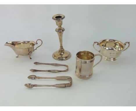 Circular silver, porringer, gravy boat, two pairs of sugar tongs and christening mug 13oz, together with a weighted silver ca