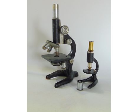 A vintage Minocular microscope together with a further students microscope and vintage camera in case (3).
