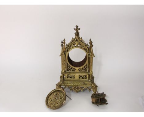 Victorian gothic gilt brass mantle clock with pierced architectural case, dismantled, the clock 41 cm high