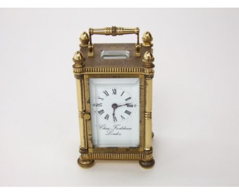 Charles Frodsham of London miniature brass carriage clock, with engraved fancy brass case mounted with acorn finials and enam
