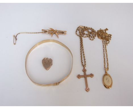 A collection of 9ct gold items to include a curb link chain with 9ct cross, a chain link necklace with 9ct pendant, a 9ct gol