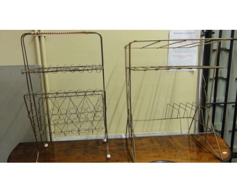 Two 1950s wirework freestanding Canterburies together with a further 1950s Ercol dressing stool and a further stainless steel