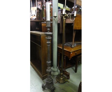 A silver plated lamp standard of three quarter height in a 17th century Italian style together with a further brass lamp stan