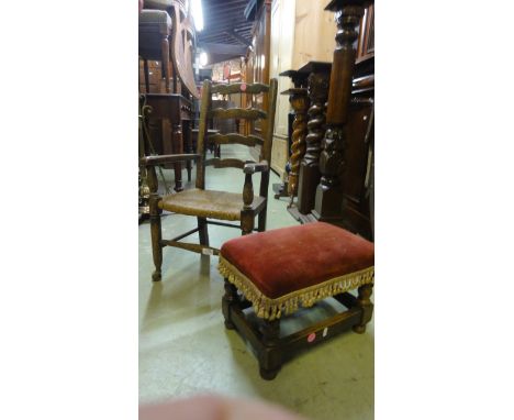 A traditional child's open elbow chair with wavy ladder back over a rush seat, raised on twin turned supports and pad feet to