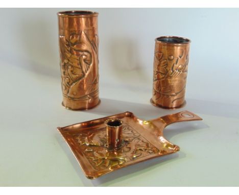Three pieces of Arts & Crafts style embossed copper in the manner Newlyn comprising two cylinder brush pots and a lantern tra