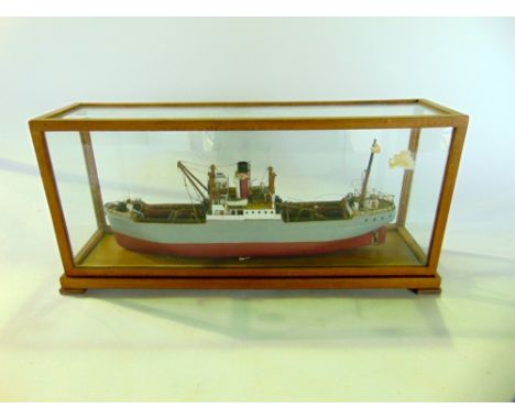 A scale model of a steam boat within a glass display case, the case 39 cm long approx.