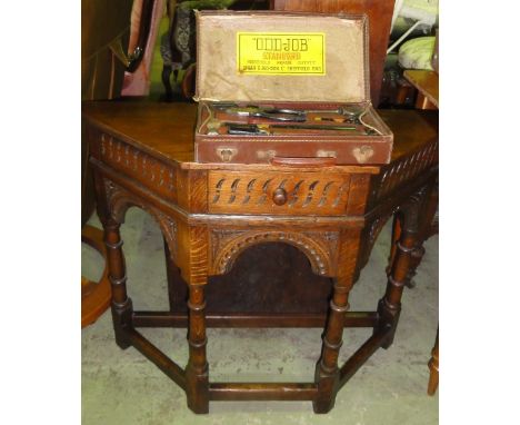 An oak hall table on turned legs, and a vintage tool kit